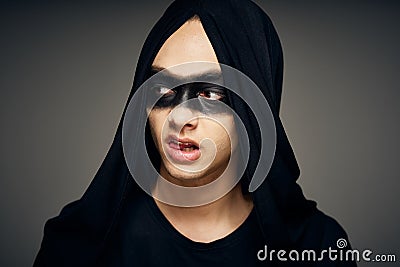 man with a dark mask horror fantasy dark background halloween Stock Photo