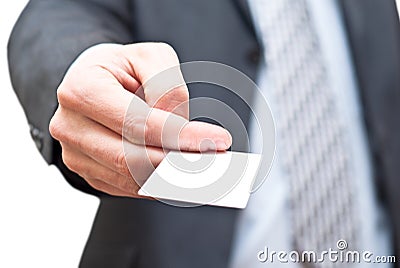 Man in dark suit giving an empty business card Stock Photo