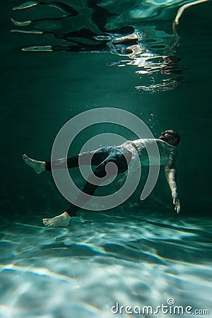 The Man in the Deep under the Water. Copy Space Stock Photo