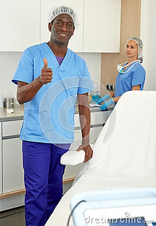 Dermatologist standing in salon of esthetic cosmetology, female on background Stock Photo