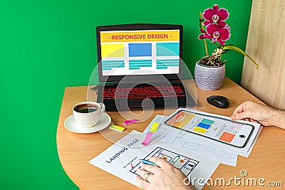 Man designing landing page website optimised for mobile â€“ web designer hands sketching responsive modern website Stock Photo