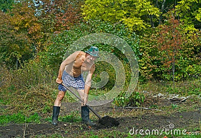 Man digs with spade 2 Stock Photo