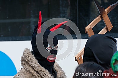 Man disguised in Devil with red hornes Editorial Stock Photo