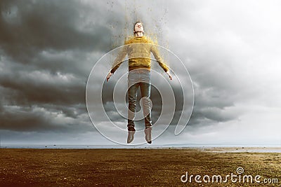 Floating man with disintegration effect Stock Photo