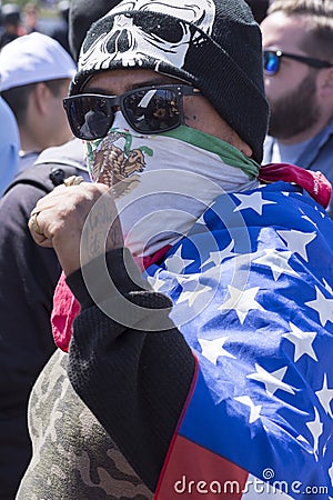 Man displays Chicano power gesture at anti-Trump protest Editorial Stock Photo