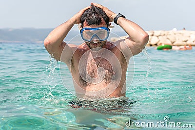 Man with diving mask in the sea Stock Photo