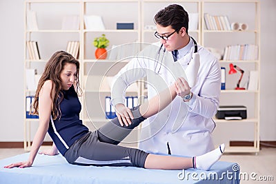 The man doctor taking care of sports injury Stock Photo