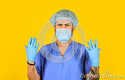 Man doctor uniform yellow background. Type of virus. Coronavirus concept. Expect virus to mutate. Human to human Stock Photo