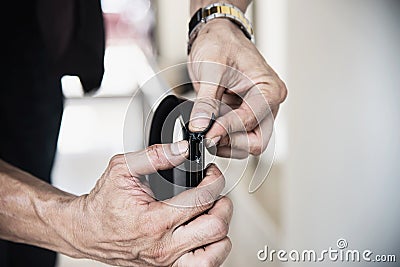 Man doing aluminum frame with glasses and wire screen door and window Stock Photo