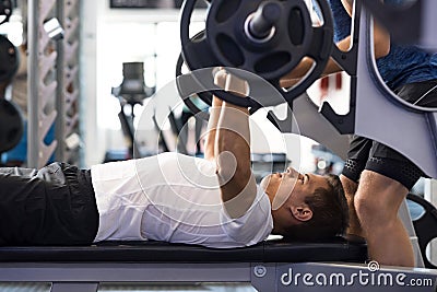 Man doing bench press Stock Photo