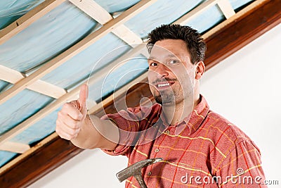 Man doing dry walling, working Stock Photo