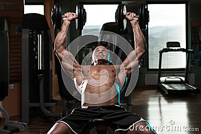 Man Doing Dumbbell Incline Bench Press Workout Stock Photo