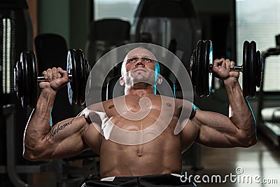Man Doing Dumbbell Incline Bench Press Workout Stock Photo