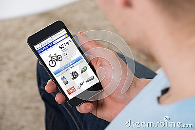 Man Doing Online Shopping On Mobilephone Stock Photo