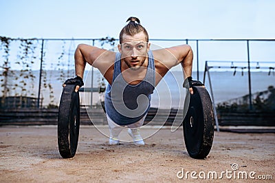 Man doing push-up exercise, street workout Stock Photo