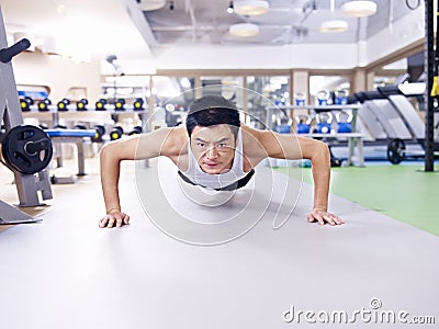 Man doing push-ups Stock Photo
