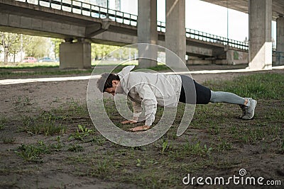 Man doing push-ups during street workout Stock Photo