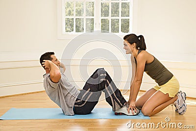 Man doing sit ups Stock Photo