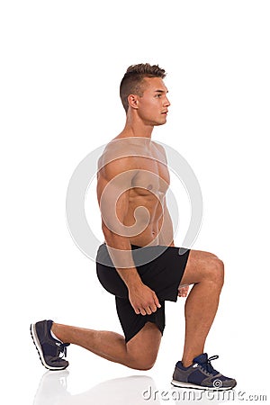 Man Doing Split Squat. Side View Stock Photo