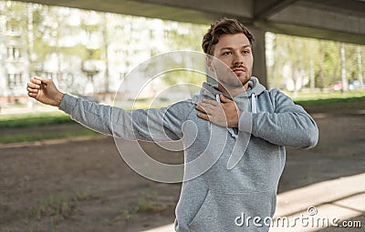 Man doing street workout alone in a city Stock Photo