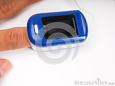 A man doing test using pulse oximeter Stock Photo