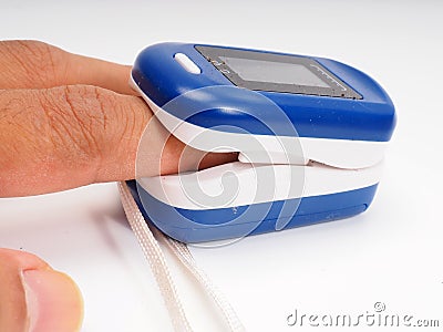 A man doing test using pulse oximeter Stock Photo