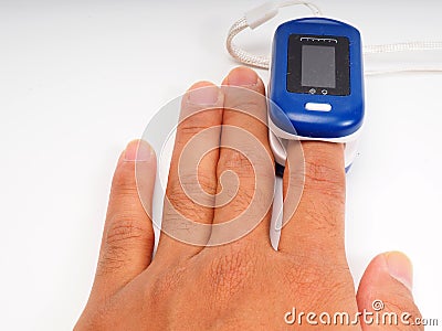 A man doing test using pulse oximeter Stock Photo