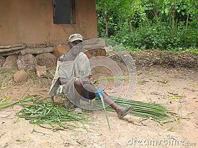 Man doing traditional works in KerÃ© Island, Bijagos Islands group, Guinea-Bissau Editorial Stock Photo