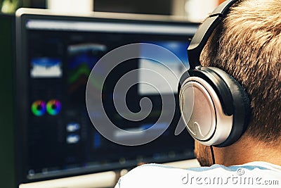 Man doing video editing on computer Stock Photo