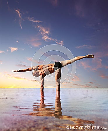 Man Doing Yoga Exercise Standing Into The Water Royalty Free Stock ...