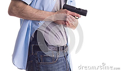 Man drawing concealed carry pistol Stock Photo