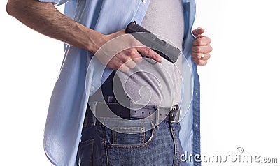 Man drawing concealed carry pistol Stock Photo