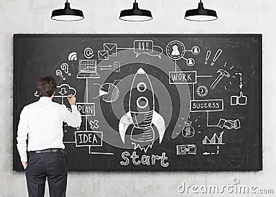 Man drawing rocket sketch Stock Photo