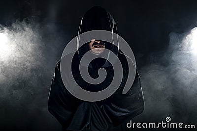 Cult Leader in a Black Robe Stock Photo