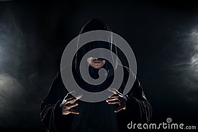 Cult Leader in a Black Robe Stock Photo