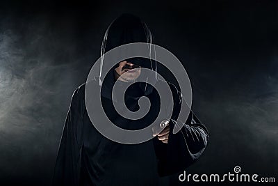 Cult Leader in a Black Robe Stock Photo