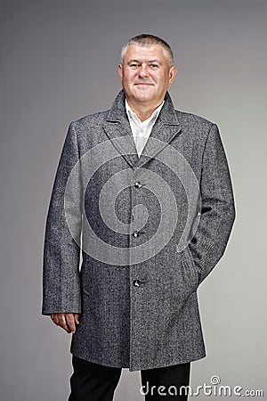 Man dressed in gray wool coat Stock Photo