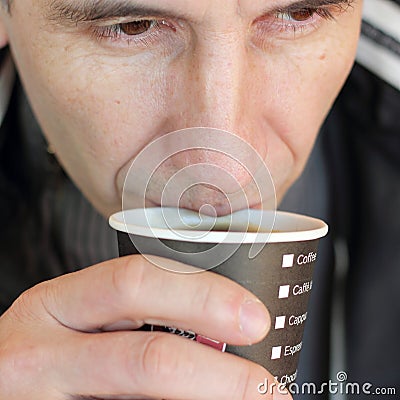 A man with a drink of coffee Stock Photo