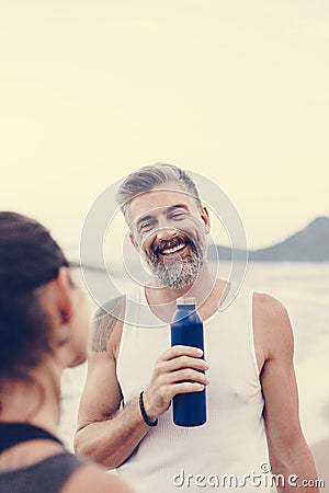 Man drinking water to rehydrate Stock Photo