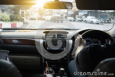 Man drive a luxury car with interior scene from rear view . Travel and relaxation concept Stock Photo