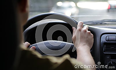 Man driver hands on helm in a car Stock Photo