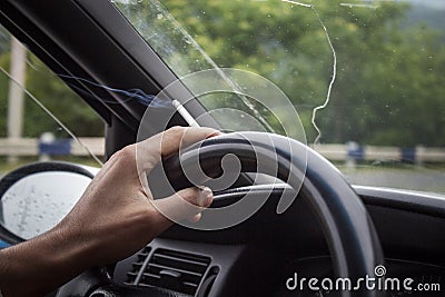 A man drives a car and smokes Stock Photo