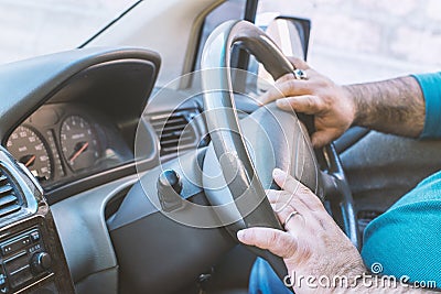 Man driving a car. Person drives a right-hand drive car Stock Photo