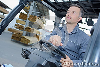 Man driving a forklift Stock Photo