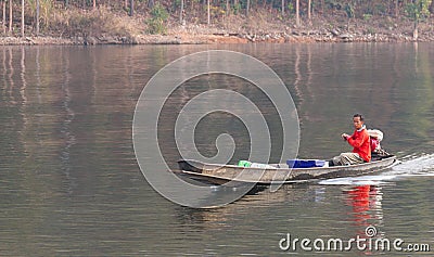 A man driving a local small boat made of iron. Editorial Stock Photo