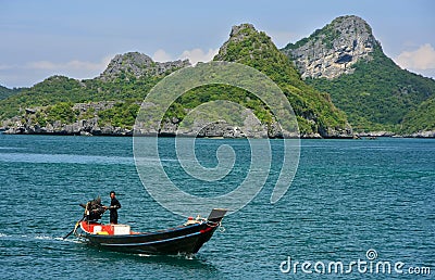 Man driving longtail boat at Ang Thong National Marine Park, Thailand Editorial Stock Photo