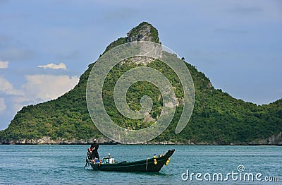 Man driving longtail boat at Ang Thong National Marine Park, Thailand Editorial Stock Photo