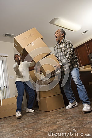 Man Dropping Stack of Boxes Stock Photo