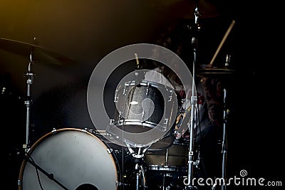 Man drum instrument performing at stage rock music. Editorial Stock Photo