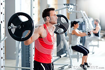 Man with dumbbell weight training equipment gym Stock Photo